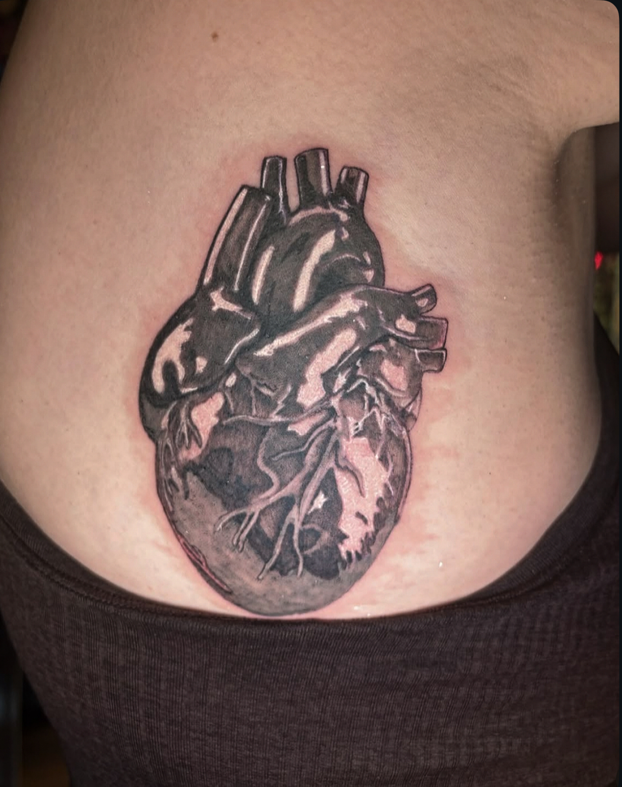 Black and grey anatomical heart tattoo by Kiwi