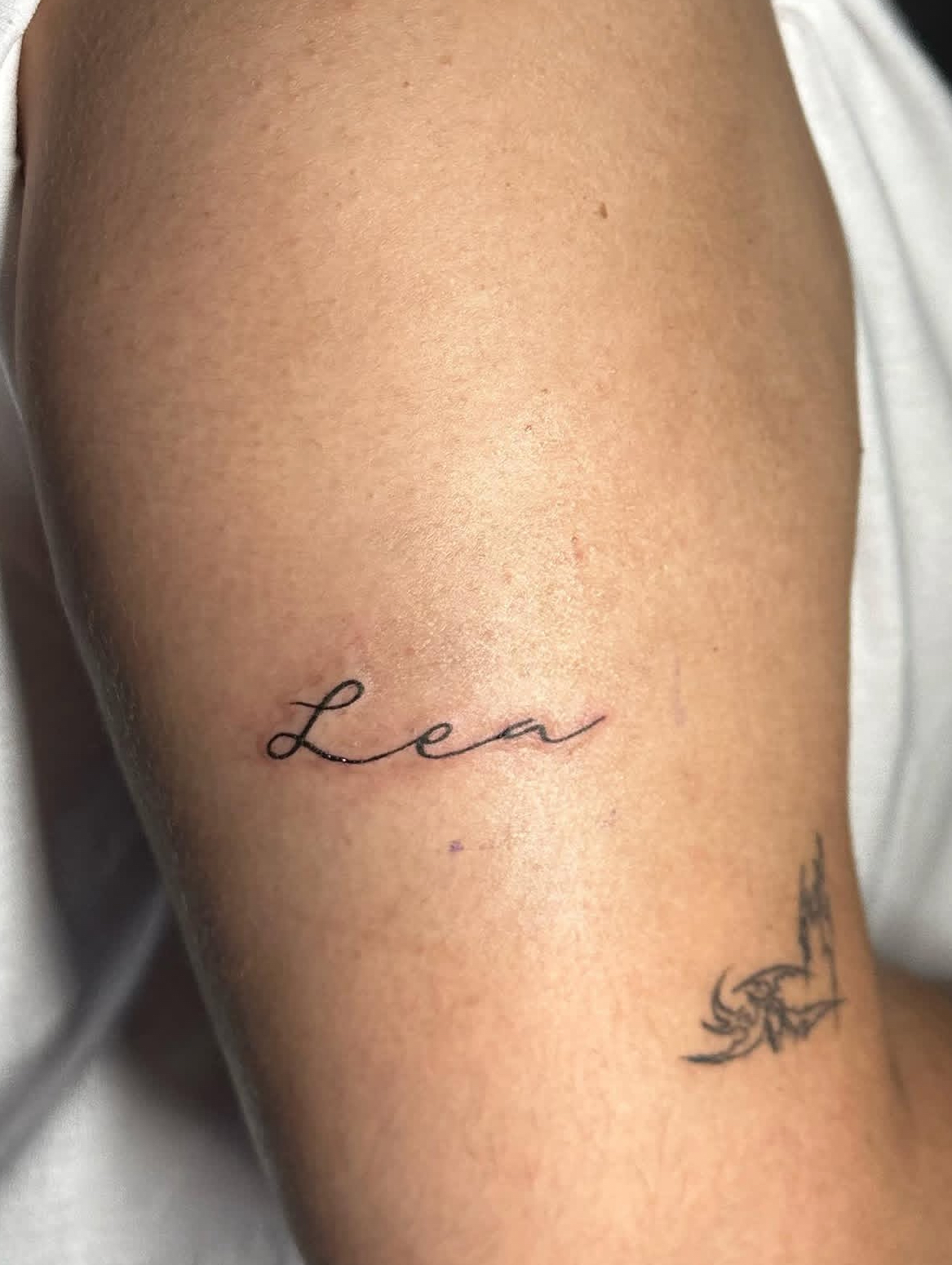 Delicate rosary chain tattoo by Lauren