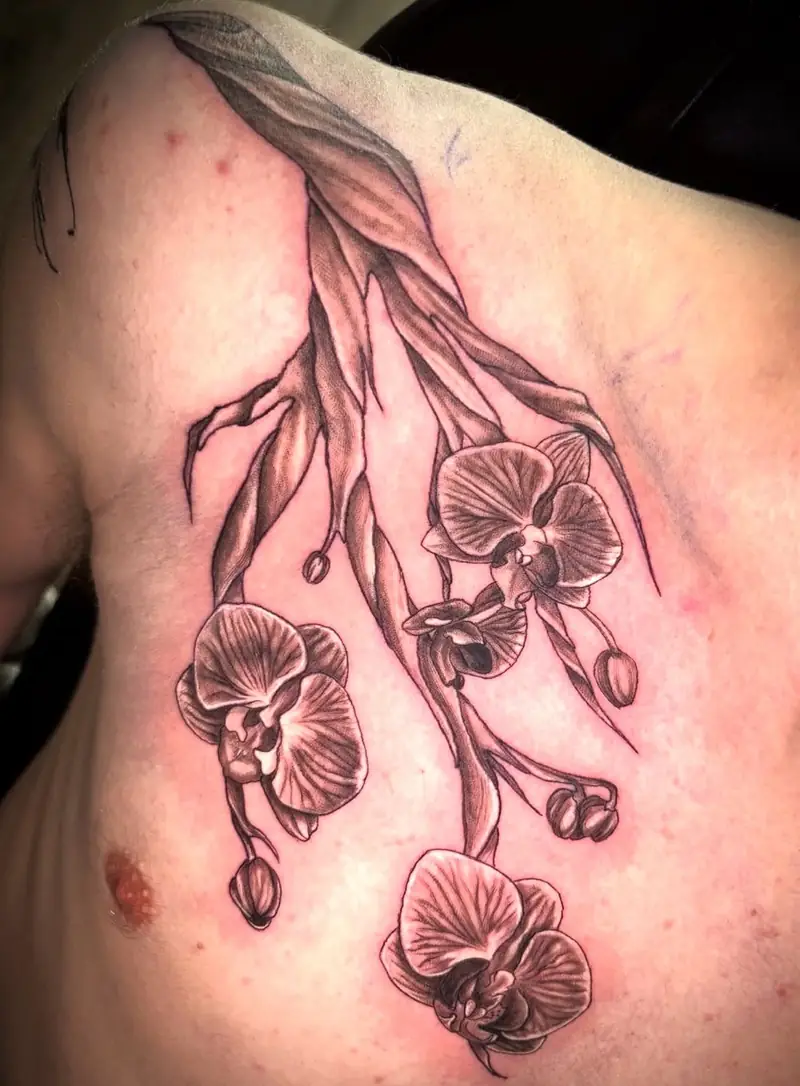 Botanical orchid chest tattoo — For the People Tattoo, Austin
